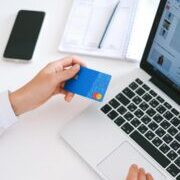 Person Holding Bank Card